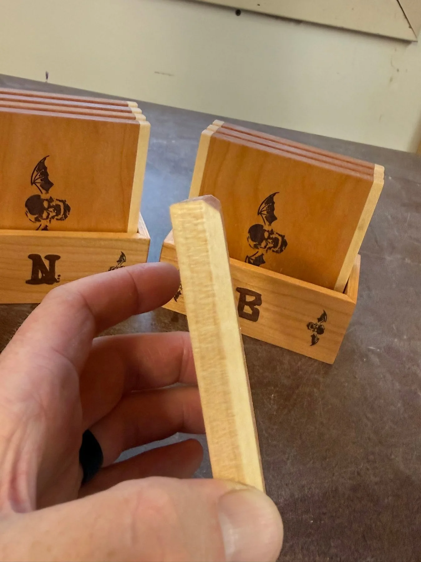 Handmade wooden coasters in matching personalized holders
